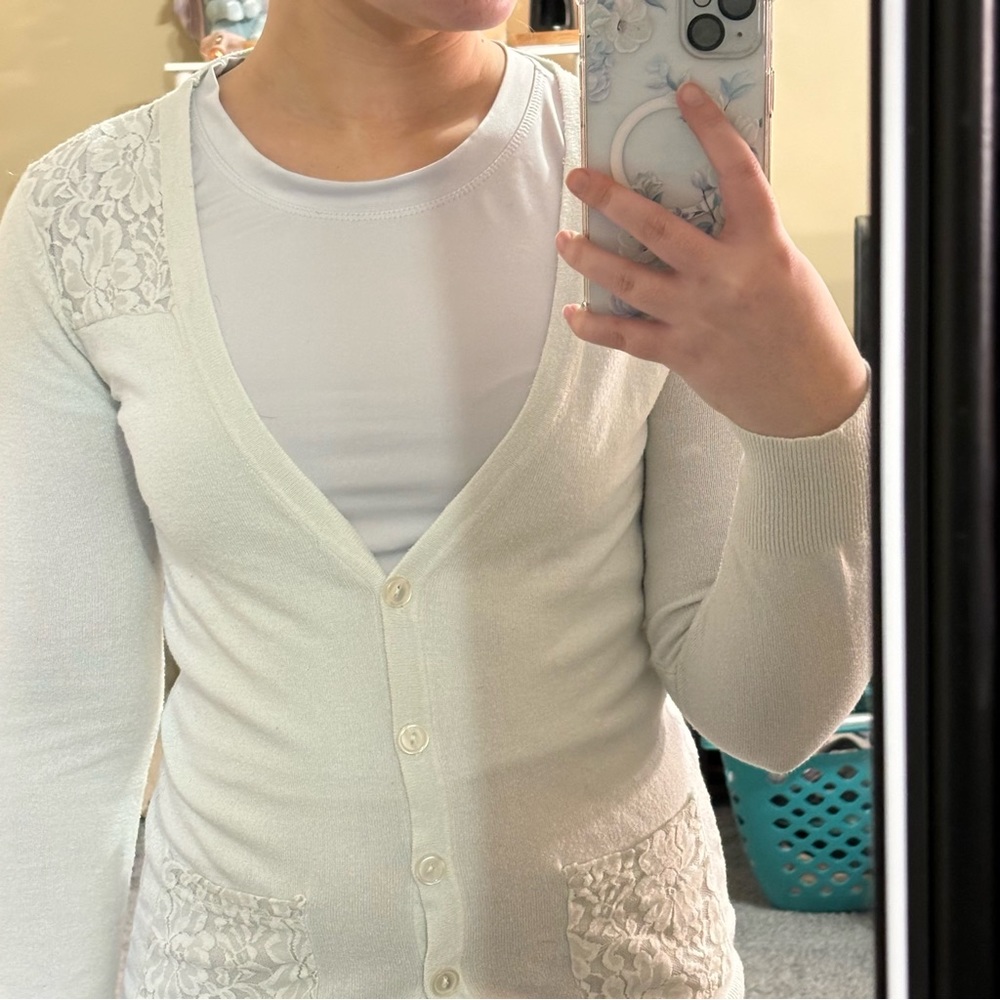 White sweater with floral pattern